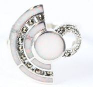 A SILVER OPAL AND MARCASITE HALF MOON RING.