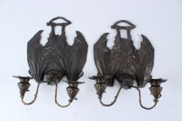 A PAIR OF BRONZE BAT WALL SCONCES. 34cms high.