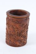 A SMALL CHINESE CARVED WOOD BRUSH POT. 11cms high.