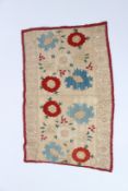 A SMALL 18TH CENTURY OTTOMAN TEXTILE with small flowers and crochet edges. 23cms x 50cms.