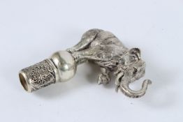 A SILVER PLATED ELEPHANT CANE HANDLE.