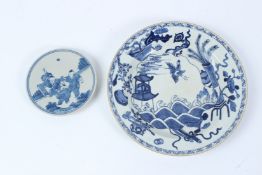 AN ANTIQUE BLUE AND WHITE PORCELAIN PIECE, 23cms diameter, and another blue and white dish, 11.