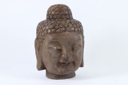 A CARVED STONE BUDDHA HEAD. 25cms high.