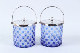 A PAIR OF BLUE AND CLEAR GLASS HOBNAIL CUT BISCUIT BARRELS with plated mounts. 16cms high.