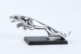 A CHROME PLATED JAGUAR CAR MASCOT ON STAND. 30cms long.