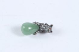 A SILVER AND JADE DOG EGG PENDANT.