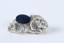 A SILVER ELEPHANT PIN CUSHION.