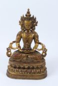 A GILT NEPALI APARMITA BUDDHA. 36cms high.