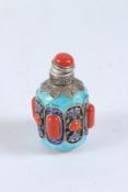 A TURQUOISE AND CORAL SNUFF BOTTLE. 8cms.