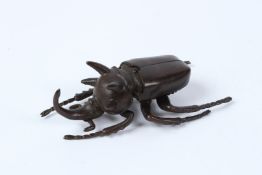 A FINE JAPANESE OKIMONO BRONZE RHINOCEROS BEETLE with articulated wings. 11cms.