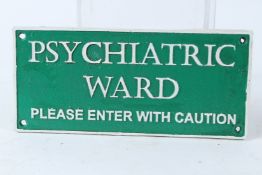 A NOVELTY CAST IRON SIGN 