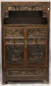 A VERY GOOD CHINESE LACQUERED CABINET inset with numerous carved panels of very high quality. The