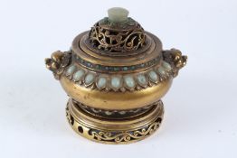 A CHINESE BRONZE AND JADE CENSER on stand. 16cms high.