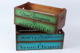 A PAIR OF NOVELTY WOODEN CHAMPAGNE CRATES. 44cms long x 26cms high.