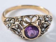 A 9CT GOLD AMETHYST AND PEARL RING.