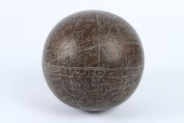 A 19TH - 20TH CENTURY INDIAN ENGRAVED BRASS CELESTIAL GLOBE. 14cms diameter.