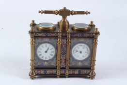 A MINIATURE BRASS AND CLOISONNE ENAMEL DOUBLE CARRIAGE CLOCK with carrying handle. 13cms high.