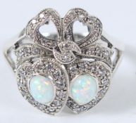 A SILVER OPAL DOUBLE SWEETHEART RING.