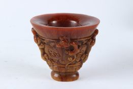 A GOOD CHINESE CARVED HORN LIBATION CUP. 13cms high.