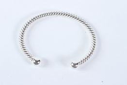 A STERLING SILVER TORQUE TWISTED BANGLE.