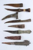 FOUR ANTIQUE SYRIAN DAGGERS, each approximately 28cms long.