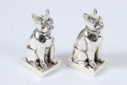 A SILVER PLATED DECO STYLE DOG SALT AND PEPPERS.