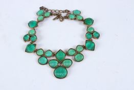 OSCAR DE LA RENTA. An ornate cast metal necklace set with green ribbed cabochon stones. 50cms long.
