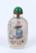 A CHINESE REVERSE PAINTED SNUFF BOTTLE. 10cms tall.