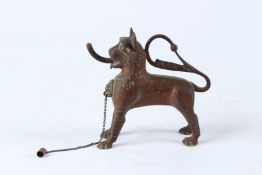 A RARE, POSSIBLY ISLAMIC, LION SHAPED BRASS OR BRONZE OIL LAMP. 12cms long.