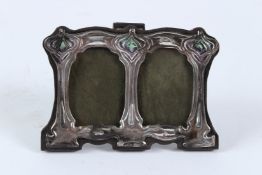A STERLING SILVER ART NOUVEAU DOUBLE PHOTOGRAPH FRAME. 8cms x 10cms.