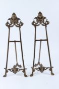 A PAIR OF ORNATE BRASS EASELS. 55cms high.