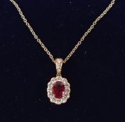 AN 18CT GOLD, RUBY AND DIAMOND OVAL PENDANT on 16inch 18ct gold fine chain.