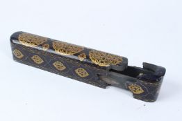 A TURKISH OTTOMAN WOODEN FOLDING PEN BOX with gold decoration. 27cms long x 5cms wide.