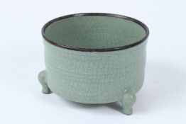 A CHINESE FINE CELADON TRIPOD PORCELAIN INCENCE BURNER. 10cms x 15.5cms diameter.