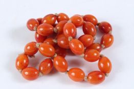 A STRING OF BUTTERSCOTCH AMBER BEADS. 60cms long.