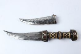 A FINE 19TH CENTURY SYRIAN OR IRAQI DAGGER with inlaid horn hilt and niello inlaid silver