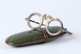 A PAIR OF 19TH CENTURY TORTOISESHELL SPECTACLE FRAMES, in a shagreen case.