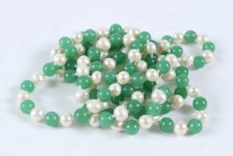 A LONG STRING OF JADE AND PEARL BEADS. 120cms long.