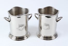 A PAIR OF POLISHED METAL 