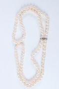 A 32 INCH DOUBLE FRESHWATER PEARL NECKLACE, with pearl separators.