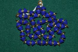 A Chinese Peking blue glass bead necklace.