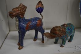 Two cloisonne beasts.