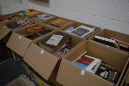 Ten boxes of assorted books.