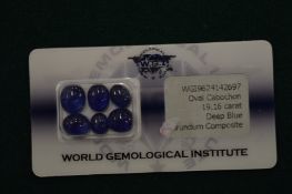 A small collection of cabochon corundum stones.