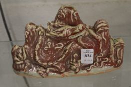 A Chinese sang de boeuf glazed dragon and mountain group.