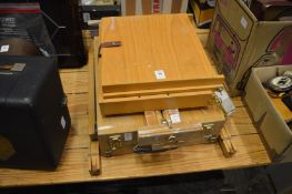 Two artist's travelling easels.