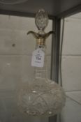 Cut glass silver topped decanter.