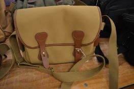 A good canvas and leather shoulder bag.