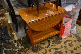 Mahogany drop-flap two-tier tea trolley.