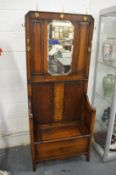 An oak hall seat with mirror.